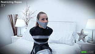 Chloe toy gets tape bondage and gagged in catsuit