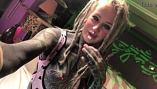 tattooed slut plays with her ass plug