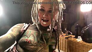 tattooed slut plays with her ass plug