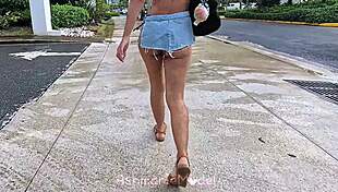 Latina woman fixes outfit at shopping center